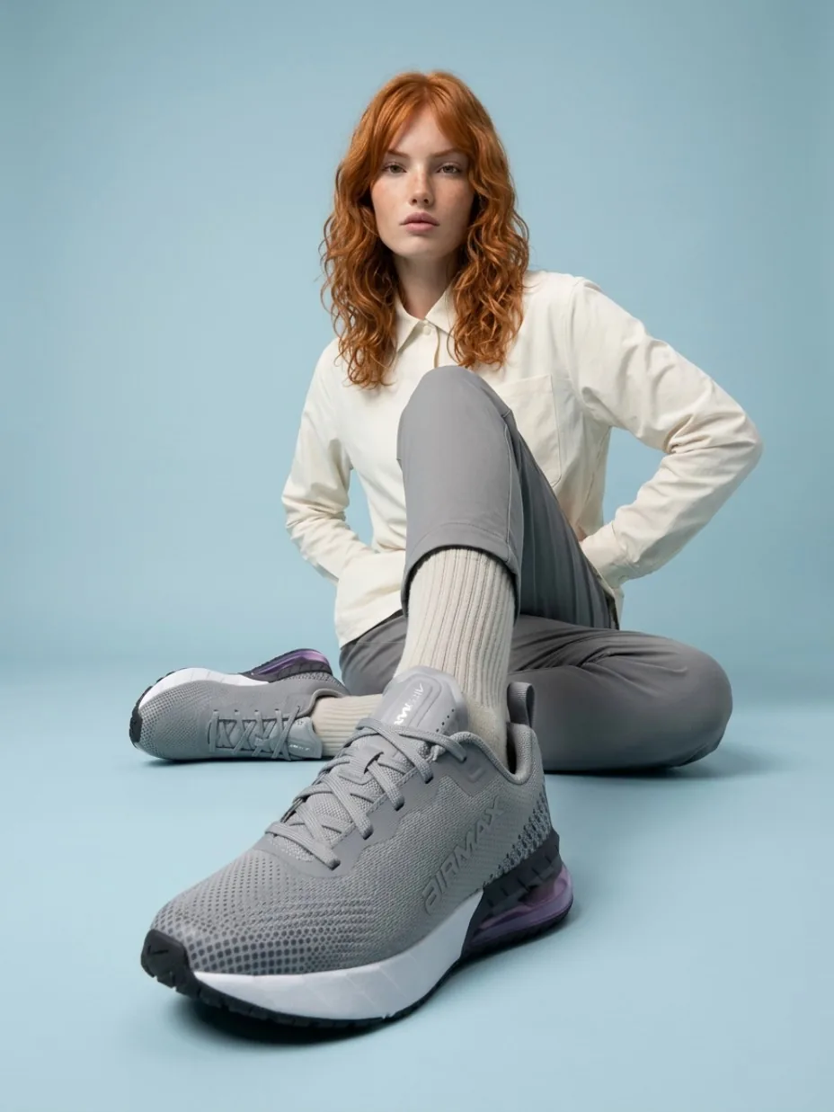 Seated model with a sneaker close to the lens