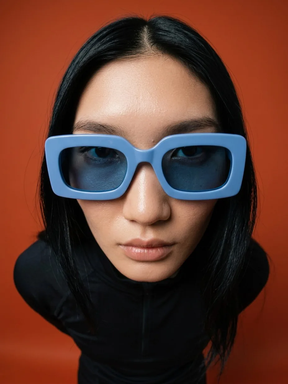 Frontal eyewear portrait with a bold wide-angle perspective