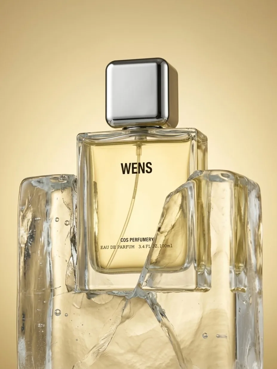 Perfume bottle staged in fractured ice